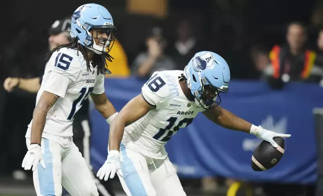 Toronto Argonauts' Dejon Brissett (18) celebrates his interception against the Winnipeg Blue Bombers during the second half of a CFL football game at the 111th Grey Cup in Vancouver, British Columbia, Sunday, Nov. 17, 2024. (Frank Gunn/The Canadian Press via AP)