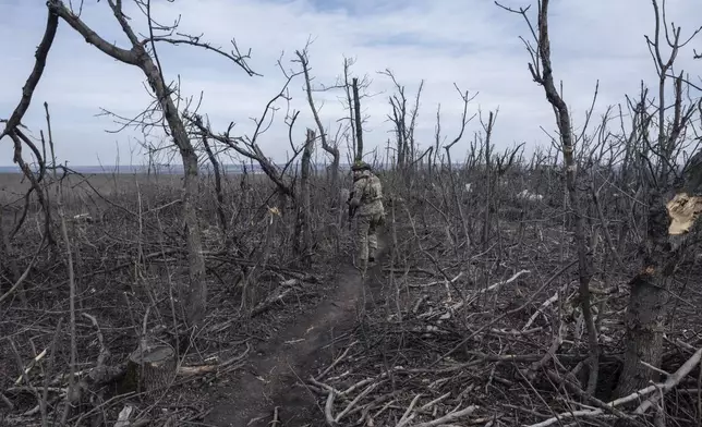 FILE - A Ukrainian soldier walks near Klishchyivka, Donetsk region, Ukraine, Monday, March 18, 2024. (Iryna Rybakova via AP, File)