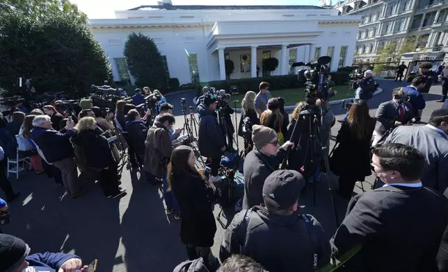 Members of the press gather outside the West Wing of the White House in Washington, Wednesday, Nov. 13, 2024, before President Joe Biden meets with President-elect Donald Trump in the Oval Office. (AP Photo/Susan Walsh)