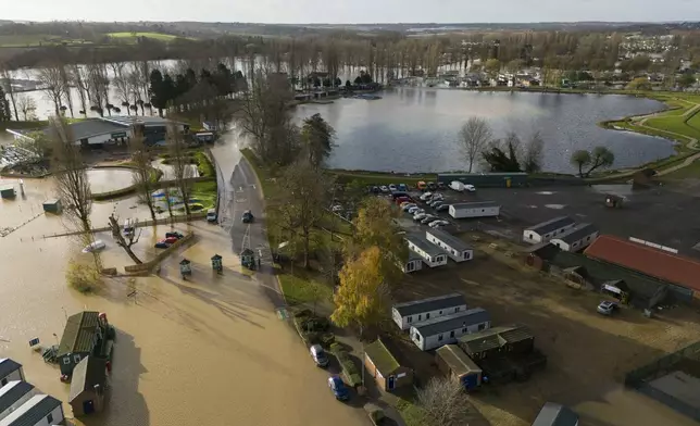 Floodwater covers parts of the Billing Aquadrome in Northamptonshire, England, Monday Nov. 25, 2024, after Storm Bert caused "devastating" flooding over the weekend. (Jordan Pettitt/PA via AP)