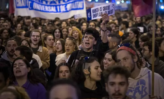 Demonstrators march to protest the skyrocketing cost of renting an apartment in Barcelona, Spain, Saturday, Nov. 23, 2024. (AP Photo/Emilio Morenatti)