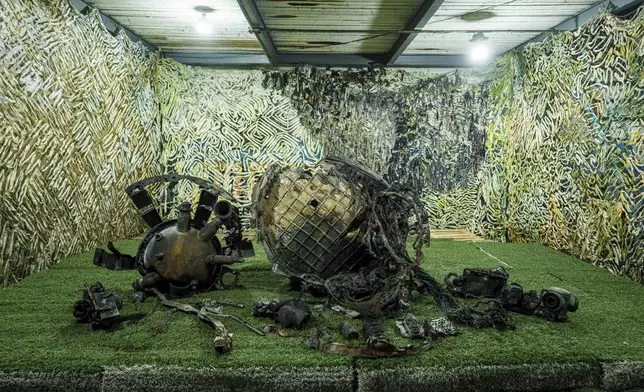 Fragments of a rocket which struck Dnipro on November 21 are seen at a center for forensic analysis in undisclosed location, Ukraine, Sunday Nov. 24, 2024. (AP Photo/Evgeniy Maloletka)