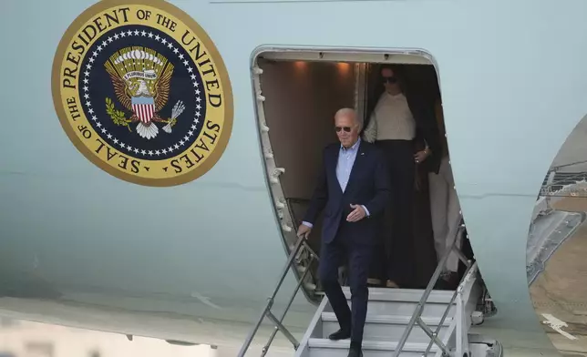 U.S. President Joe Biden deplanes in Lima, Peru, to attend the Asia-Pacific Economic Cooperation (APEC) summit, in Lima, Peru, Thursday, Nov. 14, 2024. (AP Photo/Guadalupe Pardo)