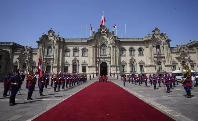 A Peruvian honor guard stand in formation at the end of a welcoming ceremony for Indonesian President Prabowo Subianto at the government palace in Lima, Peru, Thursday, Nov. 14, 2024, on the sidelines of the Asia-Pacific Economic Cooperation (APEC) summit. (AP Photo/Fernando Vergara)