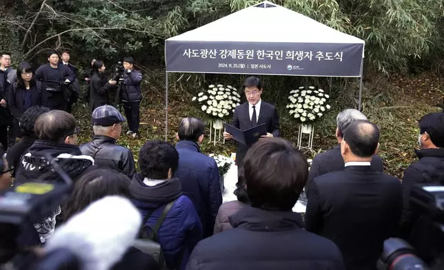 South Korean Ambassador to Japan Park Cheol-hee, center, delivers a speech as relatives of Korean victims and South Korean officials hold a memorial service in Sado, Niigata prefecture, Japan, Monday, Nov. 25, 2024, after boycotting a memorial organized by Japanese officials. (AP Photo/Eugene Hoshiko)