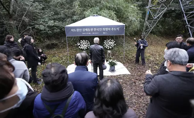 Relatives of Korean victims and South Korean officials offer a prayer during a memorial service at the site of former Fourth Souai Dormitory for the mine workers from the Korean Peninsula, in Sado, Niigata prefecture, Japan, Monday, Nov. 25, 2024, a day after boycotting a memorial organized by Japanese officials. (AP Photo/Eugene Hoshiko)