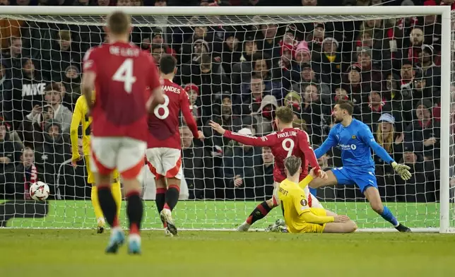 Manchester United's Rasmus Hojlund scores his side's third goal during the Europa League opening phase soccer match between Manchester United and Bodo Glimt, at the Old Trafford stadium in Manchester, England, Thursday, Nov. 28, 2024. (AP Photo/Dave Thompson)