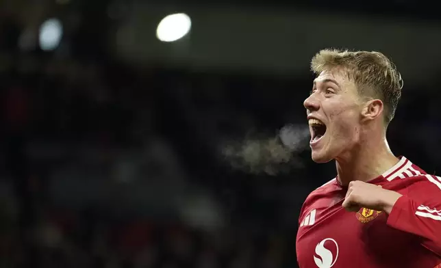 Manchester United's Rasmus Hojlund celebrates after scoring his side's second goal during the Europa League opening phase soccer match between Manchester United and Bodo Glimt, at the Old Trafford stadium in Manchester, England, Thursday, Nov. 28, 2024. (AP Photo/Dave Thompson)