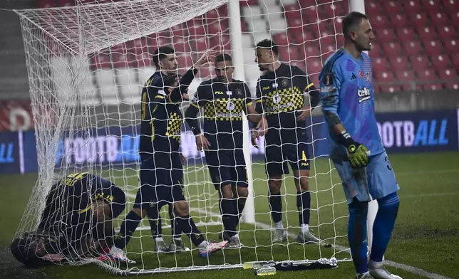 Maccabi Tel Aviv's players celebrate after Dor Peretz scored his side's second goal during the Europa League opening phase soccer match between Besiktas and Maccabi Tel Aviv, at the Nagyerdei Stadium in Debrecen, Hungary, Thursday, Nov. 28, 2024. (AP Photo/Denes Erdos)