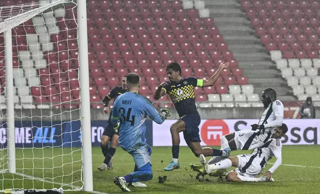 Maccabi Tel Aviv's Dor Peretz scores his side's second goal during the Europa League opening phase soccer match between Besiktas and Maccabi Tel Aviv, at the Nagyerdei Stadium in Debrecen, Hungary, Thursday, Nov. 28, 2024. (AP Photo/Denes Erdos)