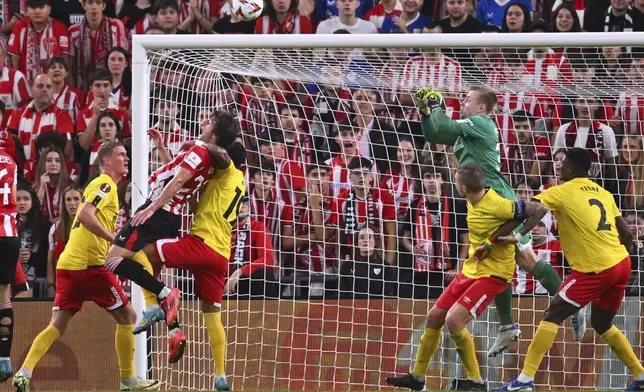 Elfsborg's Rami Kaib jumps for the ball against Athletic Bilbao's Gorka Guruzeta during the Europa League opening phase soccer match between Athletic Bilbao and Elfsborg at the San Mames stadium in Bilbao, Spain, Thursday, Nov. 28, 2024. (AP Photo/Miguel Oses)