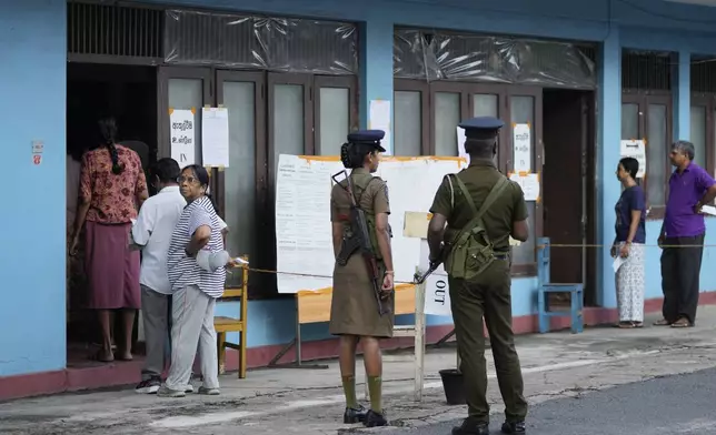 People arrive to cast their votes at a polling station during the parliamentary election in Colombo, Sri Lanka, Thursday, Nov. 14, 2024.(AP Photo/Eranga Jayawardena)