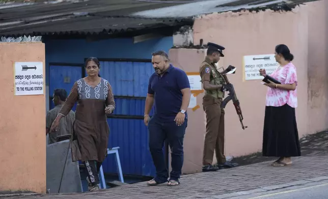 People arrive to cast their votes at a polling station during the parliamentary election in Colombo, Sri Lanka, Thursday, Nov. 14, 2024.(AP Photo/Eranga Jayawardena)