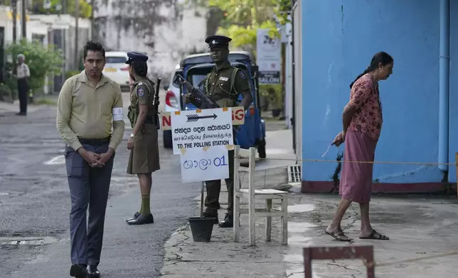 People arrive to cast their votes at a polling station during the parliamentary election in Colombo, Sri Lanka, Thursday, Nov. 14, 2024.(AP Photo/Eranga Jayawardena)