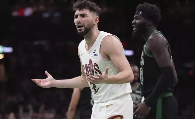 Cleveland Cavaliers guard Ty Jerome (2) argues a call during the second half of an Emirates NBA Cup basketball game against the Boston Celtics, Tuesday, Nov. 19, 2024, in Boston. The Cavaliers, who were undefeated this season, lost to the Celtics 120-117. (AP Photo/Charles Krupa)