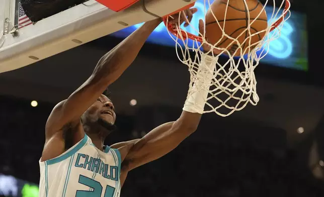 Charlotte Hornets' Brandon Miller dunks during the first half of an NBA basketball game Saturday, Nov. 23, 2024, in Milwaukee. (AP Photo/Morry Gash)