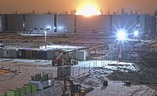 In this photo taken from video, made available on Monday, Nov. 25, 2024, a DHL cargo plane chrashes near Vilnius, Lithuania (Teltonika company via AP)