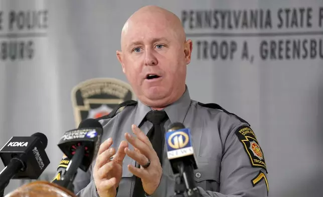 Pennsylvania State Police spokesperson Trooper Steve Limani speaks to reporters after the body of Elizabeth Pollard was recovered from sinkhole, Friday, Dec. 6, 2024, in Marguerite, Pa. (AP Photo/Matt Freed)