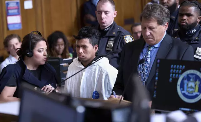 Sebastian Zapeta, 2nd left, accused of setting a woman on fire inside a New York City subway train, appears in court, Tuesday, Dec. 24, 2024, in New York. (AP Photo/Curtis Means via Pool)