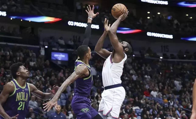 Los Angeles Clippers guard James Harden shoots a layup against New Orleans Pelicans guard Dejounte Murray (5) in the first half of an NBA basketball game in New Orleans, Monday, Dec. 30, 2024. (AP Photo/Peter Forest)