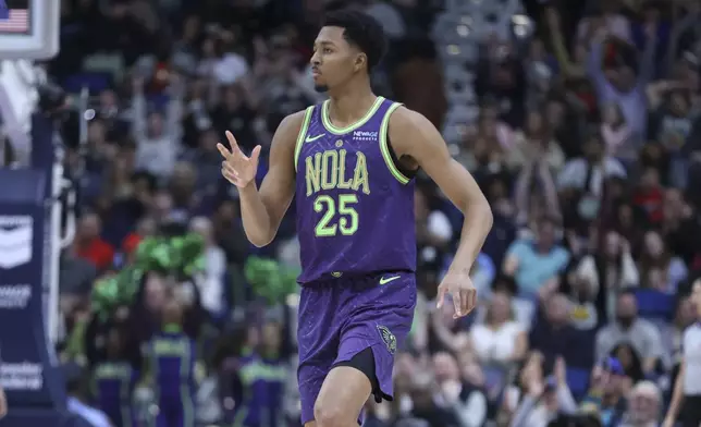 New Orleans Pelicans guard Trey Murphy III celebrates after making a three-pointer in the first half of an NBA basketball game against the Los Angeles Clippers in New Orleans, Monday, Dec. 30, 2024. (AP Photo/Peter Forest)