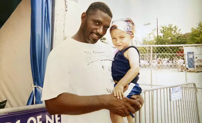 This undated family photo released by Orlando Gilbert shows Orlando with his father John "Prince" Gilbert in younger days. (Orlando Gilbert via AP)