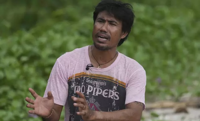 Suriyan Klathale speaks during an interview with The Associated Press at Surin Islands, Phang Nga Province, Thailand, Monday, Dec. 9, 2024. (AP Photo/Sakchai Lalit)