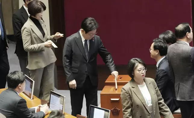 South Korea's opposition Democratic Party leader Lee Jae-myung casts his ballot during a plenary session for the impeachment motion against South Korean acting President Han Duck-soo at the National Assembly in Seoul, South Korea, Friday Dec. 27, 2024. (AP Photo/Ahn Young-joon)