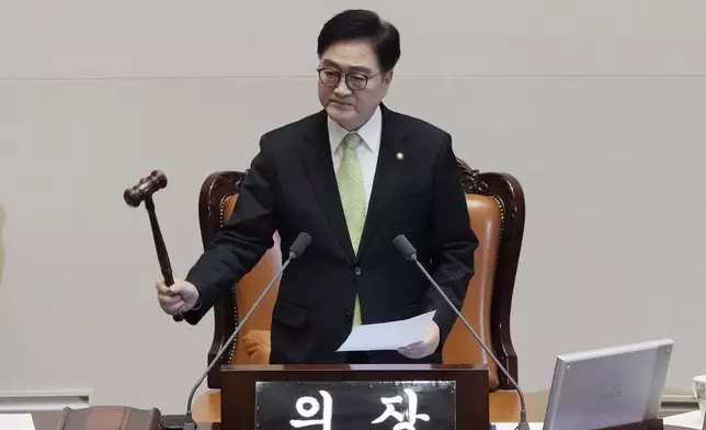 South Korea's National Assembly Speaker Woo Won Shik bangs a gavel during a plenary session for the impeachment motion against South Korean acting President Han Duck-soo at the National Assembly in Seoul, South Korea, Friday Dec. 27, 2024. (AP Photo/Ahn Young-joon)