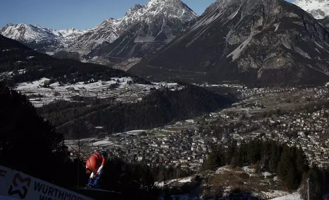 Switzerland's Marco Odermatt is airborn during an alpine ski, men's World Cup downhill training, in Bormio, Italy, Friday, Dec. 27, 2024. (AP Photo/Gabriele Facciotti)