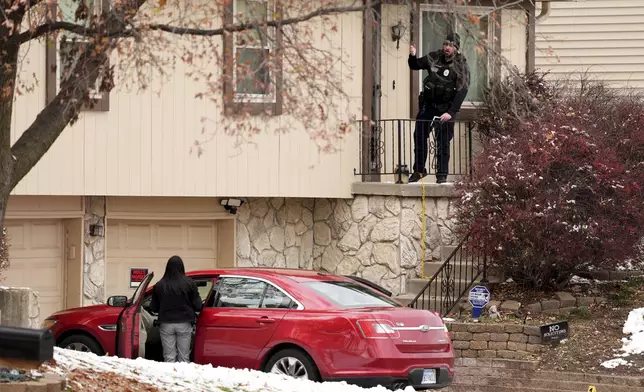 Police work the scene at the home of former police detective Roger Golubski on Monday, Dec. 2, 2024, in Edwardsville, Kan. (AP Photo/Charlie Riedel)