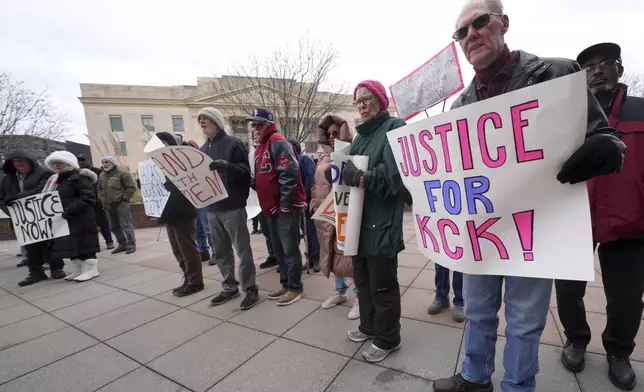 People rally outside the federal courthouse on what was to be the opening day of a trial for former police detective Roger Golubski, Monday, Dec. 2, 2024, in Topeka, Kan. (AP Photo/Charlie Riedel)