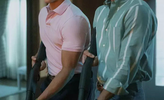 This image released by Netflix shows Cooper Koch as Erik Menendez, right, and Nicholas Chavez as Lyle Menendez in a scene from "Monsters: The Lyle And Erik Menendez Story." (Miles Crist/Netflix via AP)