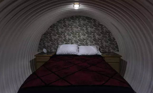 A bedroom is shown inside an underground shelter in an undisclosed Southern California city, Monday, Dec. 16, 2024. (AP Photo/Jae C. Hong)