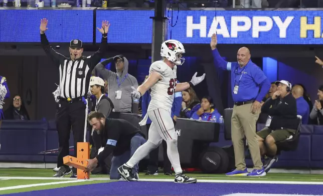 Arizona Cardinals tight end Trey McBride (85) reacts after a pass deflected off his helmet and was intercepted by Los Angeles Rams cornerback Ahkello Witherspoon during the second half of an NFL football game Saturday, Dec. 28, 2024, in Inglewood, Calif. (AP Photo/Ryan Sun)