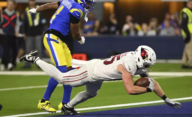 Arizona Cardinals tight end Trey McBride (85) lunges into the end zone for a touchdown during the second half of an NFL football game against the Los Angeles Rams, Saturday, Dec. 28, 2024, in Inglewood, Calif. (AP Photo/Alex Gallardo)