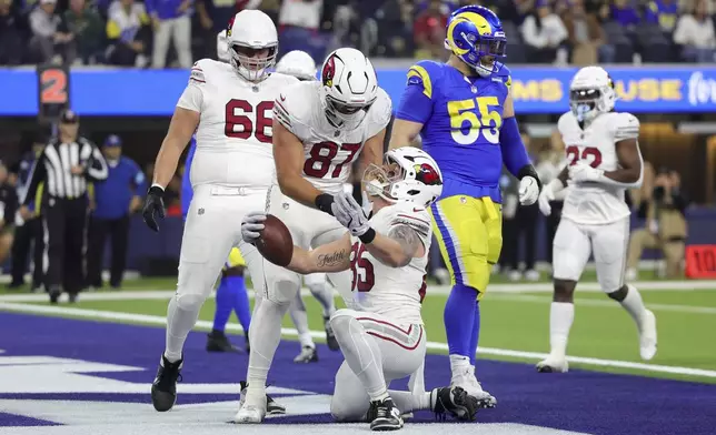 Arizona Cardinals tight end Trey McBride (85) celebrates his touchdown catch with teammates during the second half of an NFL football game against the Los Angeles Rams, Saturday, Dec. 28, 2024, in Inglewood, Calif. (AP Photo/Ryan Sun)