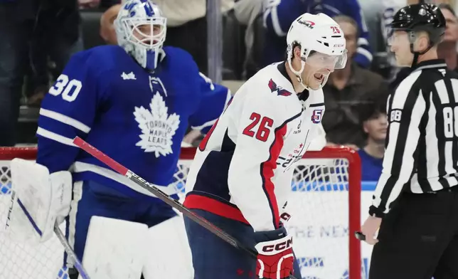 Washington Capitals' Nic Dowd (26) celebrates after his goal against Toronto Maple Leafs goaltender Matt Murray (30) during second-period NHL hockey game action in Toronto, Saturday, Dec. 28, 2024. (Frank Gunn/The Canadian Press via AP)