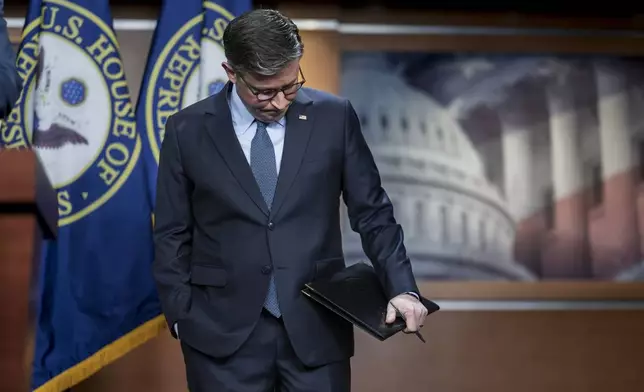 Speaker of the House Mike Johnson, R-La., pauses before talking to reporters about work on a final version of a spending bill before federal agencies run out of money at midnight on Friday night, at the Capitol in Washington, Tuesday, Dec. 17, 2024. (AP Photo/J. Scott Applewhite)