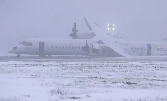 An Air Canada Express flight operated by Pal Airlines skidded off the runway Saturday night after catching fire at Halifax Stanfield International Airport is seen on Sunday, Dec. 29, 2024, in Halifax, Nova Scotia. (Darren Calabrese/The Canadian Press via AP)