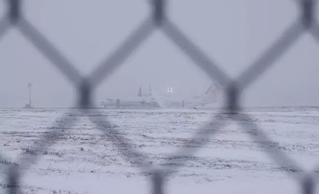 An aircraft that skidded off the runway Saturday night after catching fire at Halifax Stanfield International Airport is seen on Sunday, Dec. 29, 2024, in Halifax, Nova Scotia. (Darren Calabrese/The Canadian Press via AP)