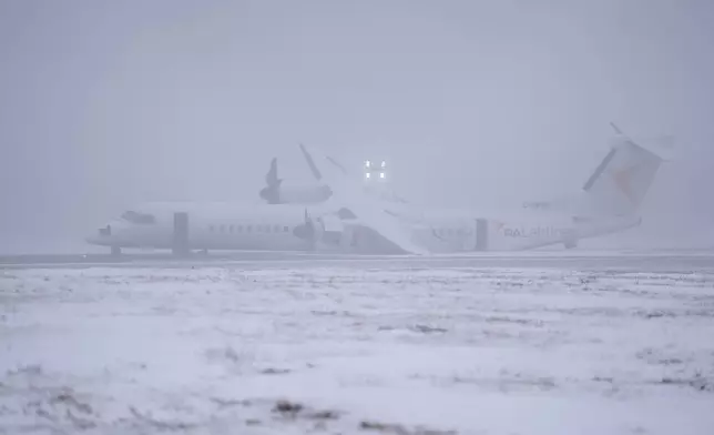 An Air Canada Express flight operated by Pal Airlines skidded off the runway Saturday night after catching fire at Halifax Stanfield International Airport is seen on Sunday, Dec. 29, 2024, in Halifax, Nova Scotia. (Darren Calabrese/The Canadian Press via AP)