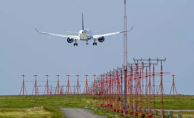 An airliner arrives at Halifax Stanfield International Airport in Enfield, N.S. on Monday, June 28, 2021. (Andrew Vaughan/The Canadian Press via AP)