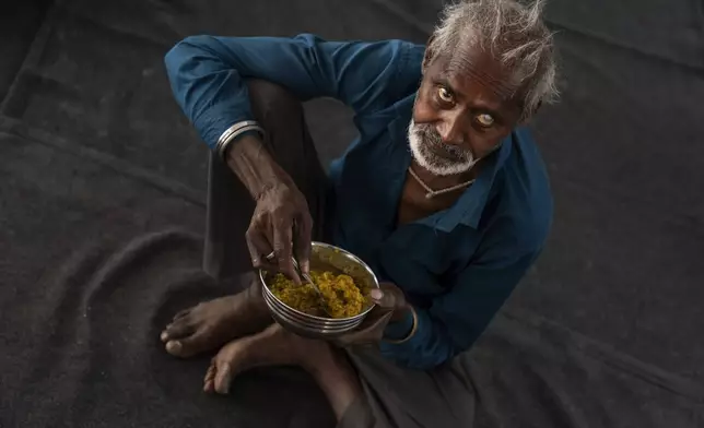 Atmaram, who goes by one name and was found living on the street a day earlier, eats breakfast at Saint Hardyal Educational and Orphans Welfare Society, a home for the aged and unwanted, on April 12, 2024, in New Delhi, India. (AP Photo/David Goldman)