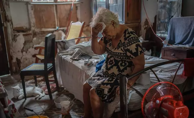 Margarita Salazar, 82, wipes sweat from her forehead in her home during an extreme heat wave in Veracruz, Mexico, on June 16, 2024. (AP Photo/Felix Marquez)