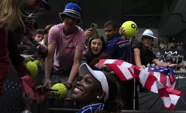 Sloane Stephens of the U.S. signs autographs after defeating Daria Kasatkina of Russia in their second round match at the Australian Open tennis championships at Melbourne Park, Melbourne, Australia, on Jan. 18, 2024. (AP Photo/Louise Delmotte)