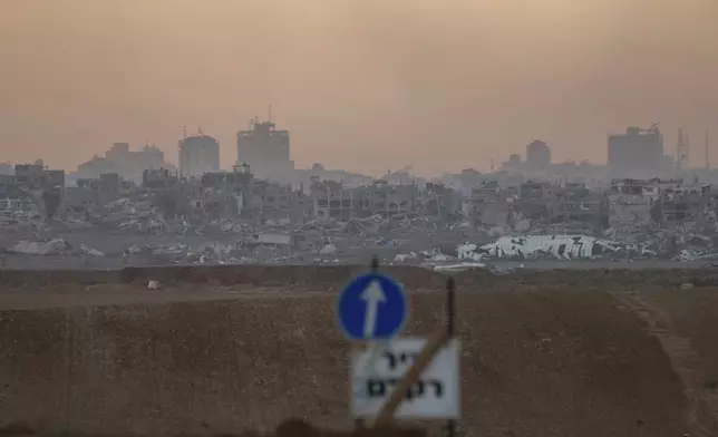 Destroyed buildings in the Gaza Strip as seen from southern Israel, Thursday Dec. 5, 2024. (AP Photo/Ohad Zwigenberg)