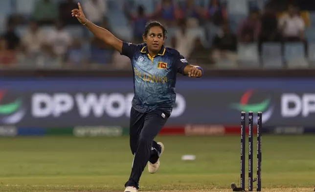 FILE - Sri Lanka's captain Chamari Athapaththu celebrates after she runout India's Smriti Mandhana during the ICC Women's T20 World Cup 2024 match between India and Sri Lanka at Dubai International Stadium, United Arab Emirates, Wednesday, Oct. 9, 2024. (AP Photo/Altaf Qadri, File)