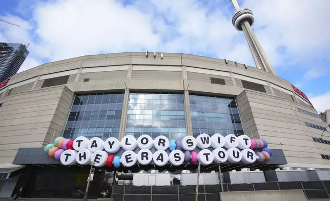 FILE.- A sign replicating the popular Taylor Swift bracelet is displayed in front of Rogers Centre promoting Swift's The Eras Tour in Toronto, on Nov. 13, 2024. (Chris Young/The Canadian Press via AP, File)