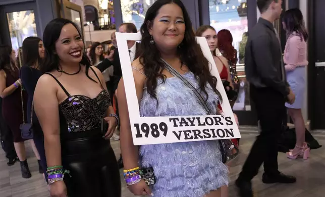 FILE - Karen Boncan, left, and Petrushka Seville arrive at the world premiere of the concert film "Taylor Swift: The Eras Tour" on Oct. 11, 2023, in Los Angeles. (AP Photo/Chris Pizzello, File)